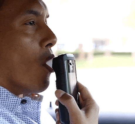 Young man passing car breathalyzer test