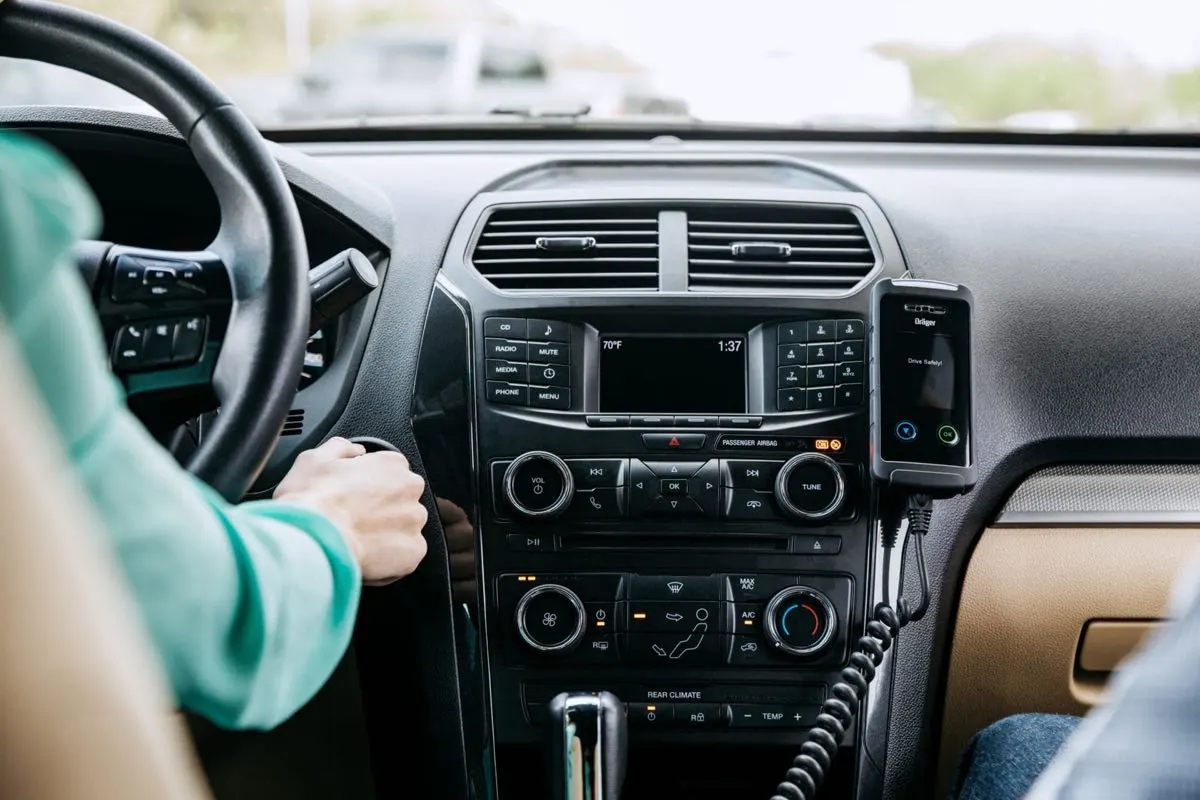 Interlock handset mounted beside the center console on a coiled cord
